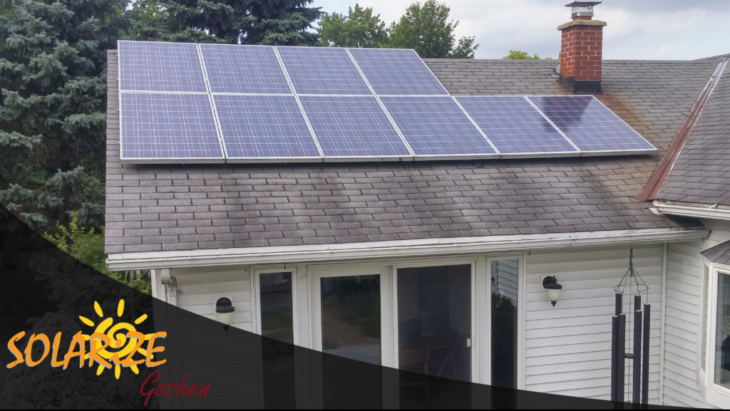 A white house with solar panels on the roof. The Solarize Goshen logo is located on the lower left corner.